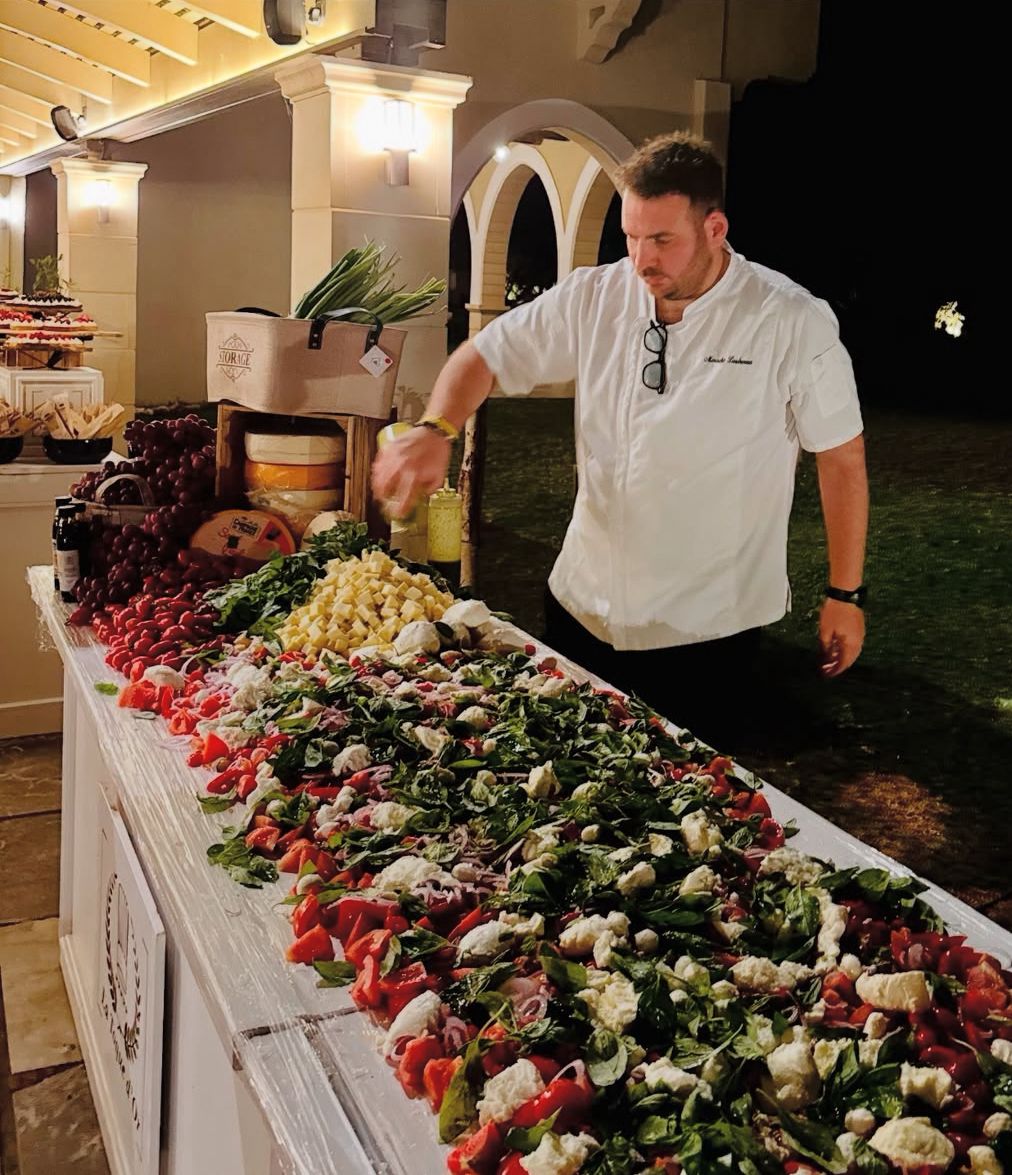 A long caprese spread at a night event