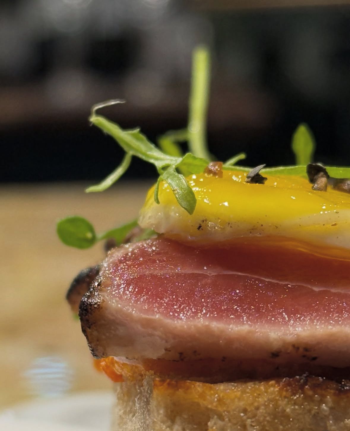 Seared tuna tataki canapé with citrus and microgreens