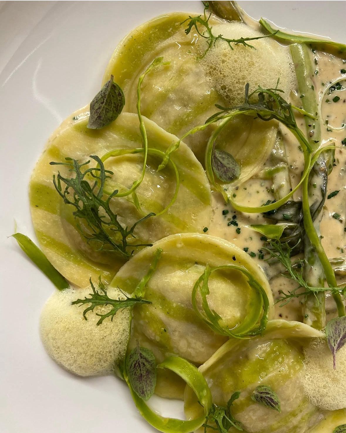 Hand-rolled green ravioli with shaved asparagus