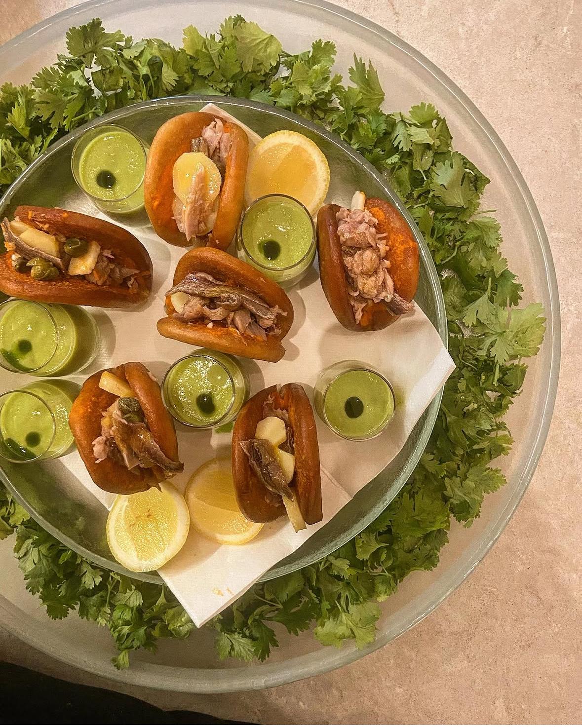 Vivid platter with green sauces and fresh herbs